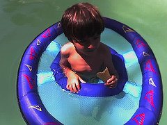 boy floating in water Hot enough for ya? Tips for staying cool when its hotter than hell outside