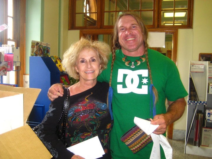 blonde woman standing next to cody lundin